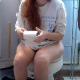 A girl with red hair is recorded pissing and taking a shit while sitting on a toilet. Poop sounds are audible. We are not sure if this is a real voyeur video. About a minute.